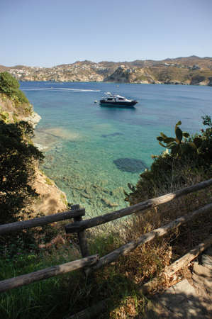 Blue lagoon on Crete with stone, clear water and boat, Greeceの写真素材