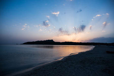 Sunset on the Beach of Rena di Ponente, Sardinia Island, Italy.の写真素材