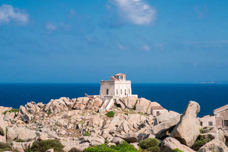 Small Old House near Lighthouse of Capo Testa. Santa Teresa di Gallura, Sardinia island, Italy. Mediterranean Sea. Corsica Island on Background.の写真素材
