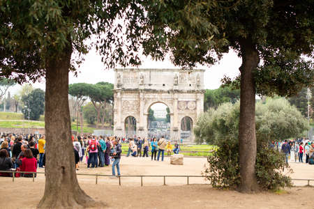 Rome. Italy - March 22, 2017: Arch of Constantine with Lots of Tousists in Rome. Italy.