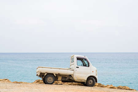Protaras. Cyprus - October 9, 2018: White Truck in Protaras on Cyprus. Sea on Background.のeditorial素材