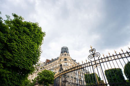 Paris. France - May 17, 2019: Beautiful Old Building Located at the Crossroads of Rue Auguste Comte and Avenue de L' Observatoire Streets in Paris, France. Entrance Gate of Luxembourg Gardens.のeditorial素材