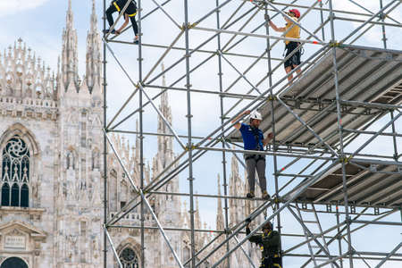 Milan. Italy - May 21, 2019: Workers Assemble a Steel Structure in Front of Milan Cathedral. Italy. Stage Construction for Performances.のeditorial素材