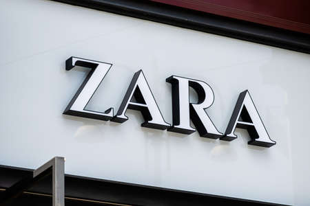 Milan. Italy - May 21, 2019: Logo of Zara Company on Store Entrance in Milan.のeditorial素材