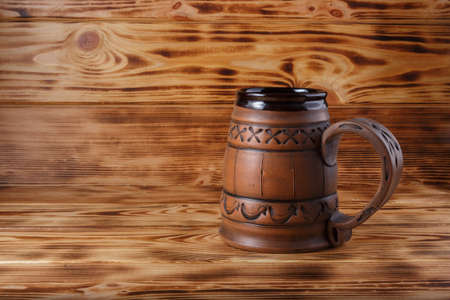 ceramic beer mug on wooden backgroundの写真素材