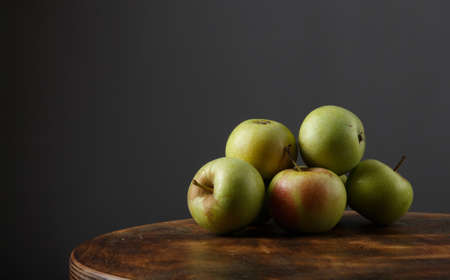 apples on wood. gray backgroundの写真素材