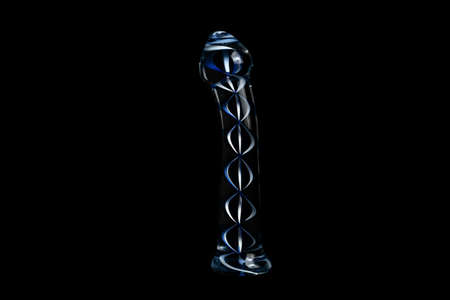 Glass penis (dildo) on a black backgroundの写真素材