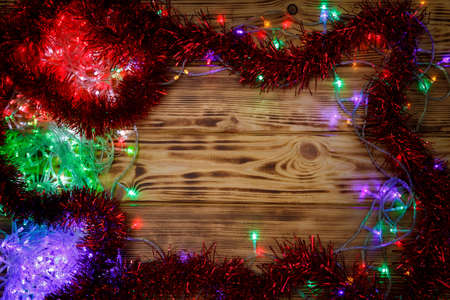 Christmas rustic background - vintage planked wood with lights and free text space