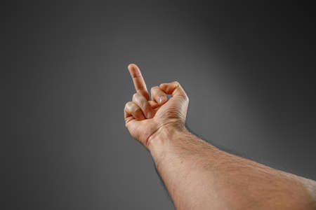 hand on a gray background. "back off" gesture.の写真素材