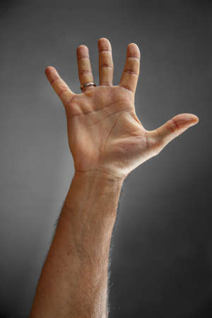 hand on a gray background. open palmの写真素材