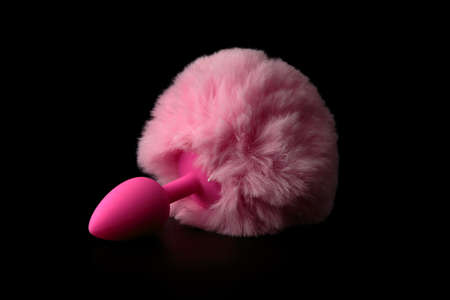 Pink anal tail plug on black background. Bunny.の写真素材