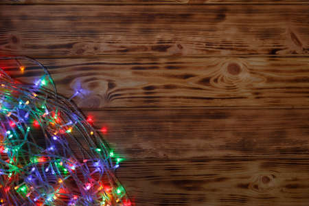 Christmas rustic background - vintage planked wood with lights and free text space