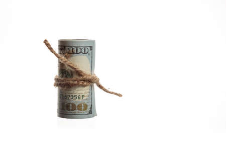 Rolled American dollars banknotes on a white backgrondの写真素材