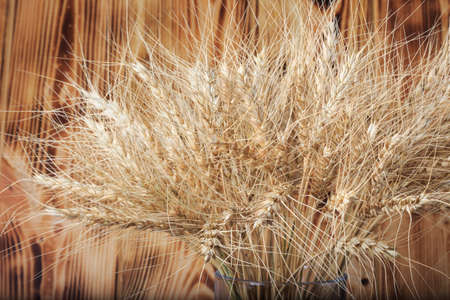 wheat on wooden backgroundの写真素材