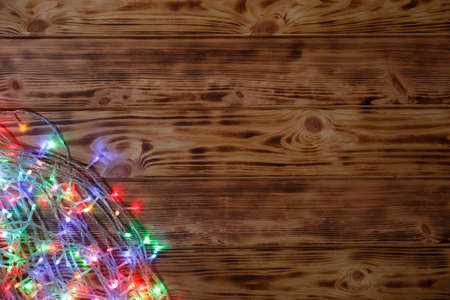 Christmas rustic background - vintage planked wood with lights and free text spaceの写真素材