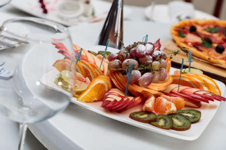 Fruit salad on a white plateの写真素材