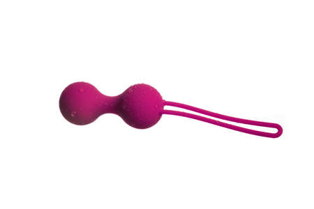 Pink vaginal balls (trainer) on a white backgroundの写真素材