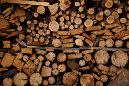 Background from random pieces of wood. Firewood.の写真素材