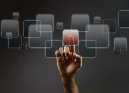 Man's hand pushing the button. Touchscreen. Rear view.の写真素材