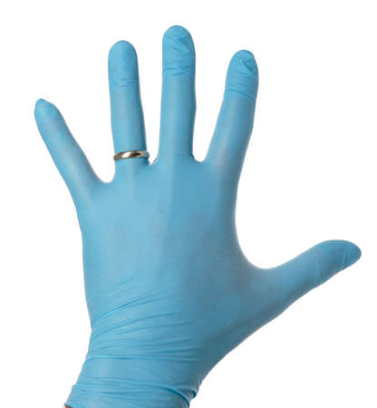 Man's gloved hand with a wedding ring outside isolated on white.の写真素材