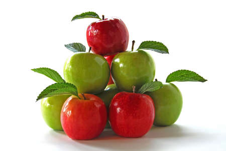 Pyramid of red and green apples on a white backgroundの写真素材