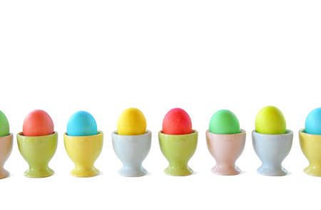 Easter eggs in pastel egg cupsの写真素材