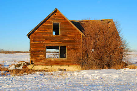 an abandoned house in a winter sceneの写真素材