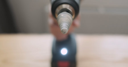 Rotation of the stone grinding head in an electric screwdriver. Rapid movement of the drill, front view, close-up.の写真素材