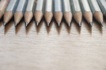 Many pencils arranged on the deskの写真素材