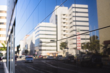 Urban landscape reflected on the window glass