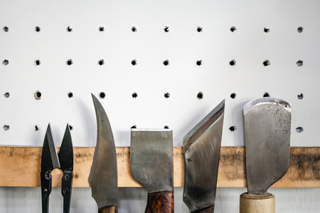 Set of leather cutting tool, knife and scissors for leather work.の写真素材