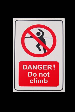 Isolated sign of "DANGER! Do not climb" with black backgroundの写真素材