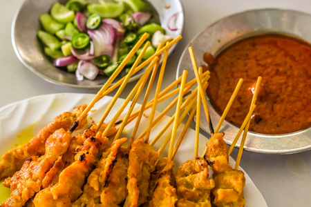 beautiful pork satays with side dishes ready to eat thai styleの写真素材