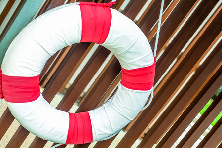 close up pool safety life ring on the lath wallの写真素材