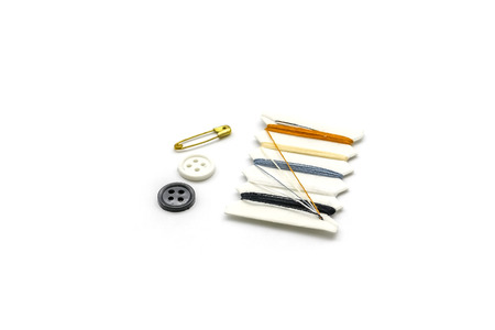 set of Brooches, buttons, thread sewing kit on white backgroundの写真素材