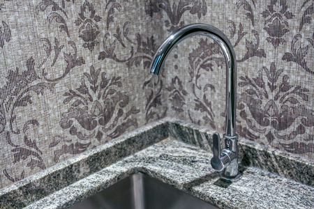 close up view of faucet tap on the sinkの写真素材