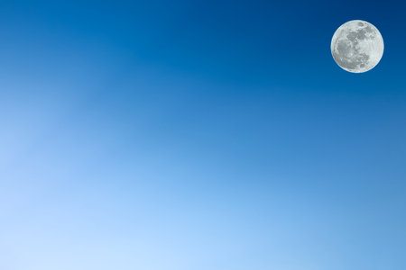 Clear blue sky as a background wallpaper, pastel sky wallpaper with super moonの写真素材