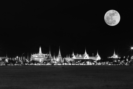 Black and white effect of Wat pra kaew Public Temple Grand palace with super moon at night, Bangkok Thailandの写真素材