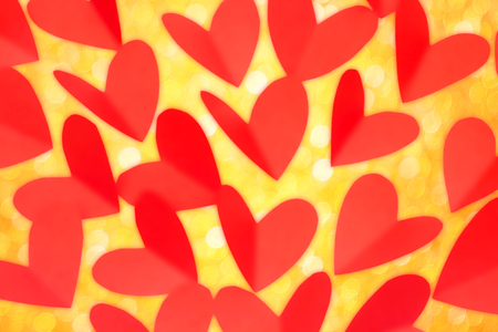 Valentine day concept, red paper in heart shape with gold glitter as backgroundの写真素材