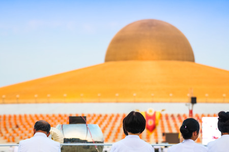 PATHUM THANI - February 11: People and monk meditation at Wat Dhammakaya in front of Dhammakaya Pagoda on February 11, 2017 in Pathum Thani, Thailand.のeditorial素材
