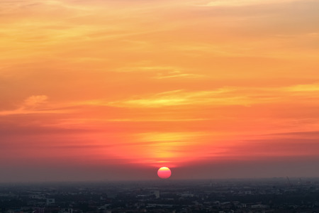 Sunrise sunset in the city with selective focus on the sunの写真素材