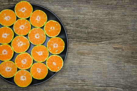 Top view of slice oranges fruit on the wooden boardの写真素材