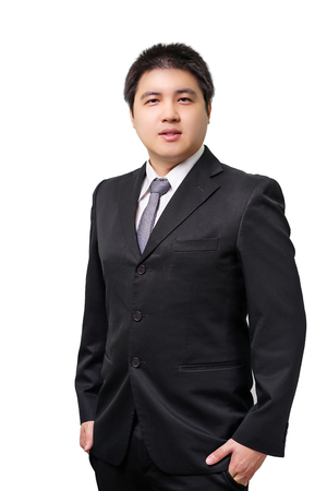 Isolated young asian business man in formal suit with necktie on white backgroundの写真素材
