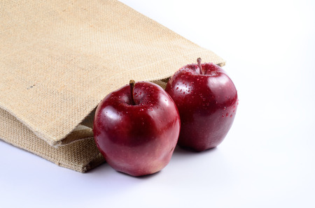 Red apples with sackclothの写真素材