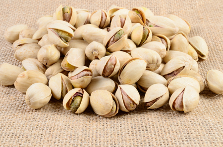 Pistachio nut on a sackclothの写真素材