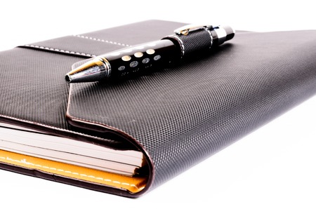 black luxury organizer with penの写真素材