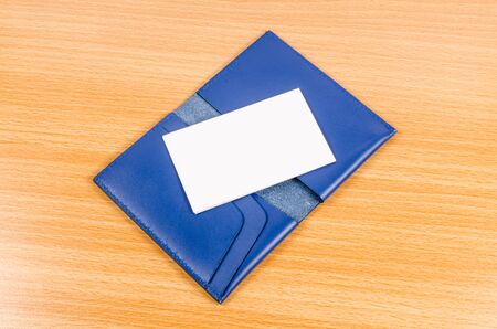 blank name card on blue leather pocketの写真素材