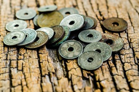 antique coins on wooden backgroundの写真素材
