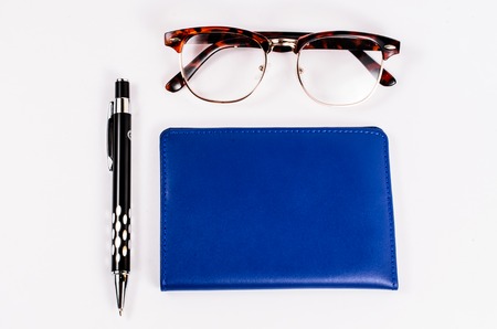 Blue leather business name card pocket with pen and glasses