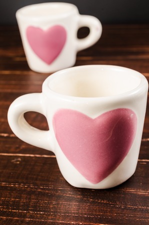 two coffee cup on wooden backgroundの写真素材